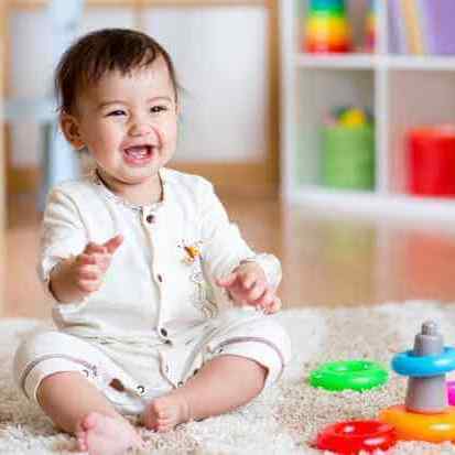 Infant are playing with toys on floor