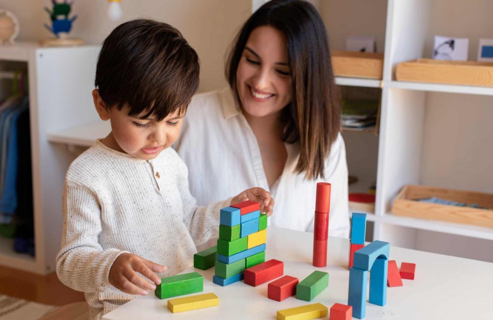 preschooler-kid-playing-with-wood-blocks with his mother